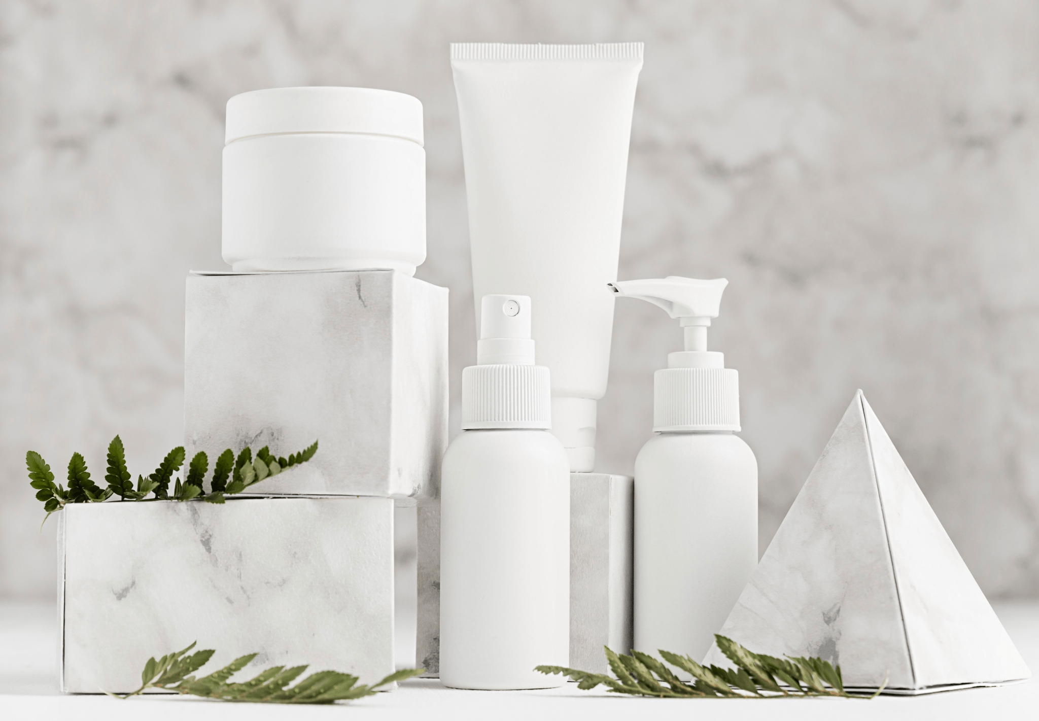 all products skincare containers collection with white bottles and marble stands