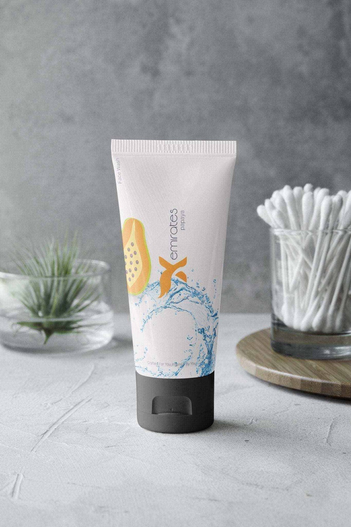 Face wash tube, CreamXemirates Deep Cleansing Facewash, in white plastic with blue splash graphics and a black cap
