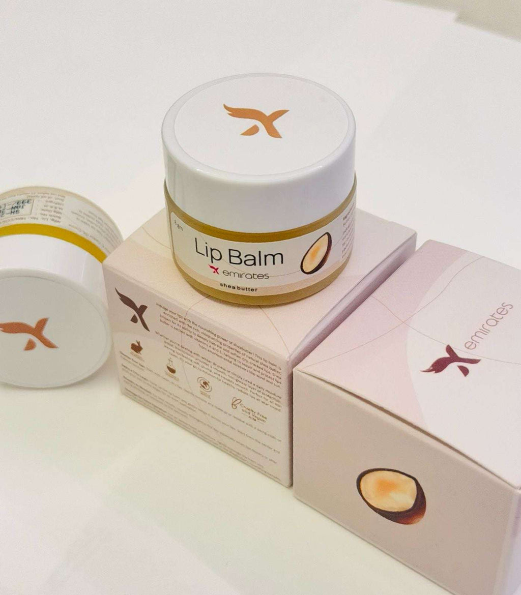X Emirates Lip Balm jar with packaging featuring shea butter, moisturizing and nourishing lip care product