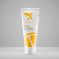 Xemirates Vitamin C Gel Face Wash in a white squeeze tube with orange graphics and a yellow logo, marked 100ml